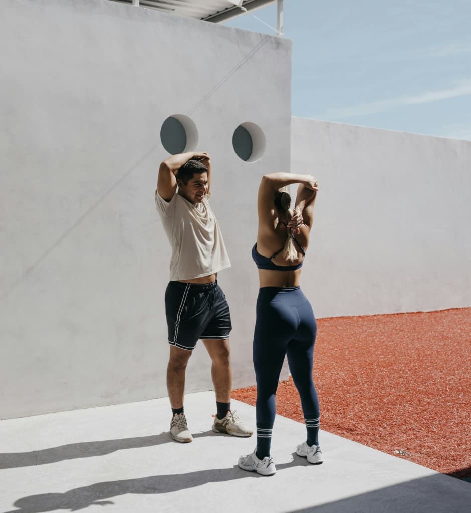 Athletes stretching after a workout
